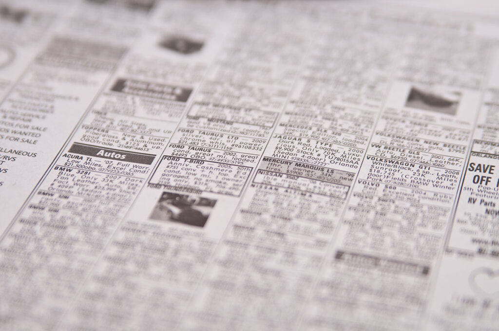 Newspaper page of classified ads
