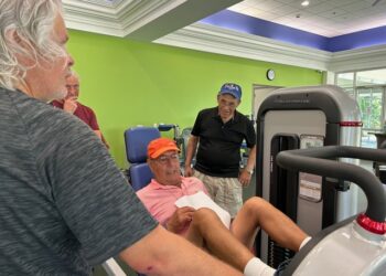 Photo by: Brenda Foster; Tennis Teaching Pro Jorge Privat and club members learn tennis fitness from John Gibson.